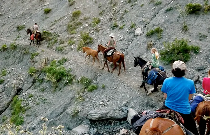 Traversing a path across an old landslip on horseback